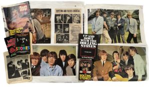 A mixed lot of vintage Rolling Stones clippings/posters (adhered to flipchart paper), magazines