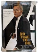 An American one sheet poster for James Bond: No Time to Die, bearing the signature of Daniel
