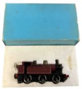 An 0 gauge 0-6-0 Jinty locomotive in maroon livery, probably Bassett-Lowke, in original box