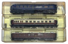 Three cased Trix H0 gauge coaches.
