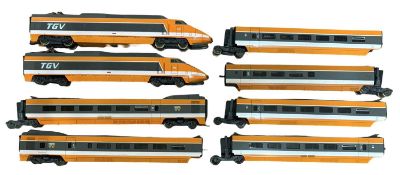 A pair of Lima 00 gauge engines and coach sets in orange livery