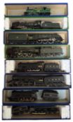 A collection of various 00 gauge locomotives and tenders in generic boxes