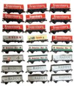A collection of Jouef 00 gauge beverage-advertising covered wagons