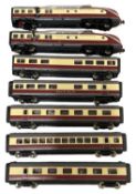 A pair of 00 gauge Roco Trans Europ Express engines, together with 4 coaches in maroon and cream