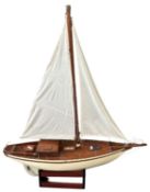 A large wooden pond yacht with linen Length approximately: 104cm / Height: 125cm