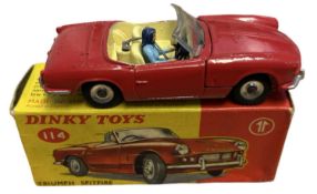 A boxed Dinky Toys 114 Triumph Spitfire in red. Some wear