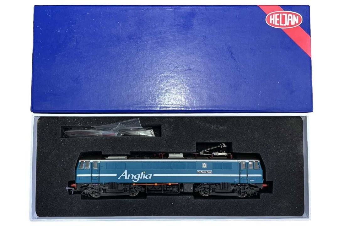 A boxed Heljan 00 gauge Class 86 'The Round Tabler' locomotive in Anglia livery, number 86021