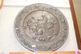 A large decorative metal platter