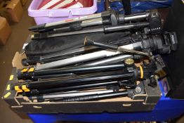 Box of various camera tripods
