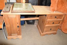 A narrow pine desk