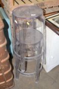 Two stacking clear plastic stools