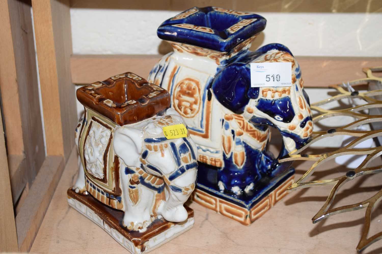 Two small ceramic elephants