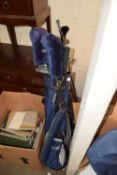 Golf bag with clubs and trolley