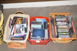 Three small boxes of various CD's