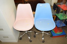 Two plastic swivel office chairs