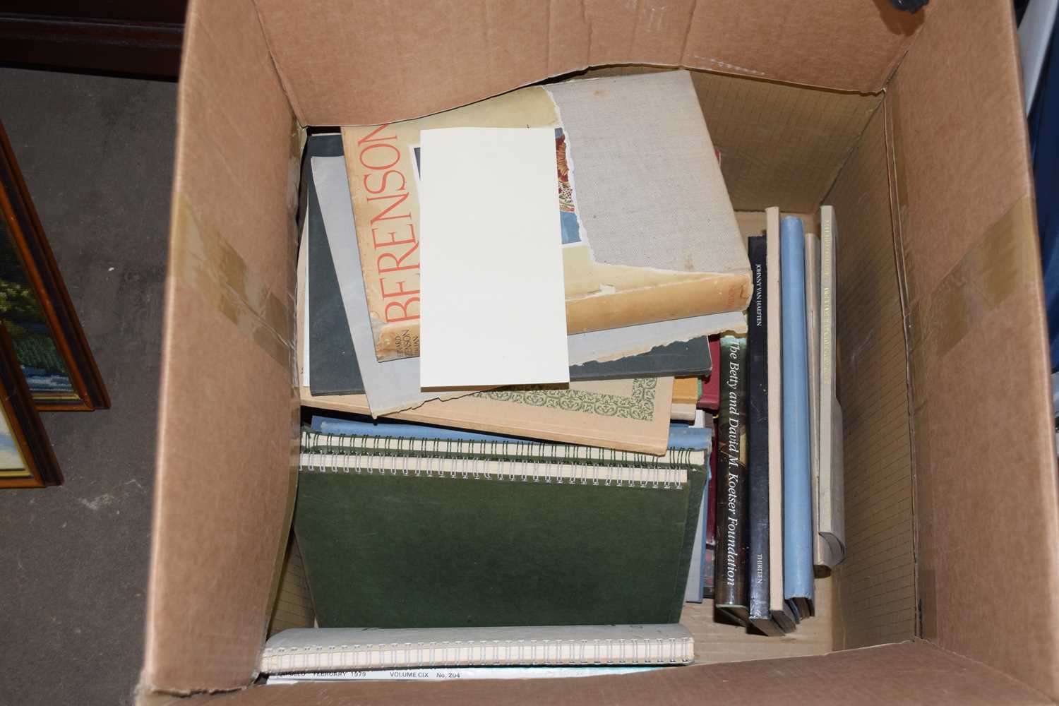 Box containing various books