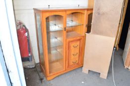Glazed wall display unit