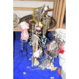 Various necklaces contained on necklace stands