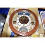 Box containing a large Seiko modern wall clock