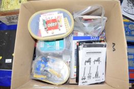Box containing a quantity of various Lego together with a quantity of Lego instruction manuals