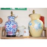 Two large table lamp bases together with two floral decorated glass shades