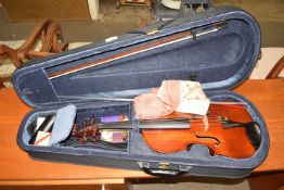 A cased modern violin