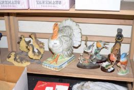Various modern bird figures including a turkey