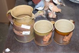 Earthenware jug and two turkey mugs