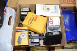 Box containing a quantity of various camera flashes and other accessories