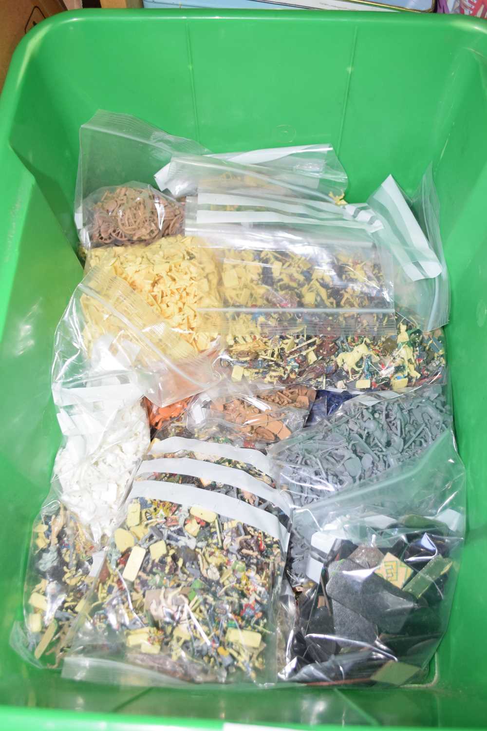 Box containing a large quantity of small moulded plastic soldier figures, a further box containing a
