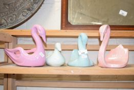 Four various swan figures