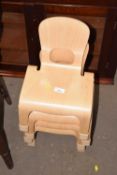 Four small stacking chairs