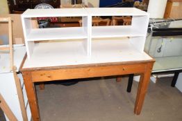Two small wooden shelving units and a side table