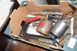 Box containing vintage oil cans, square etc