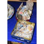 Two tins of various stamps and other items