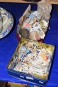 Two tins of various stamps and other items