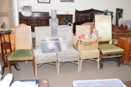 A set of three cane chairs together with two others