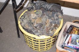 Basket containing various camouflage clothing