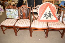 Set of four upholstered shield back dining chairs