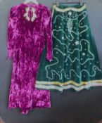 A purple velvet gown, with long sleeves and leg-of-mutton style shoulders, and gold lame