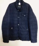 A gentleman's Barbour cowl quilted jacket, the navy blue jacket with zip and button front with patch