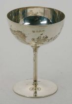 An Edwardian silver goblet having a plain circular bowl on a tapering stem to a circular foot,