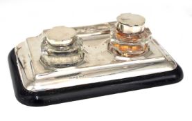 A George V silver small ink stand of rectangular form featuring two detachable glass ink bottles