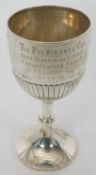 A large silver trophy of goblet form, the upper section engraved 