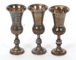 A group of three hallmarked silver Kiddush goblets, two hallmarked for London 1922 and one for