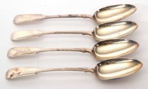 A group of four Victorian silver fiddle pattern serving spoons, hallmarked London 1846, makers