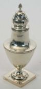 An Edwardian silver caster of plain form featuring reeded borders, standing on a square pedestal