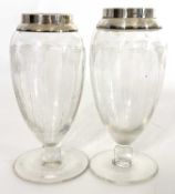 A pair of George V glass posy vases of ovoid form on a spreading foot, engraved with flowers and