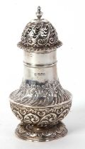 A late Victorian silver caster of baluster form, having a pull-off pierced and gadrooned decorated