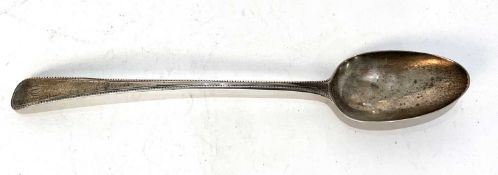 A George III silver basting spoon, circa 1780 having a feathered edge, initialled, makers mark for